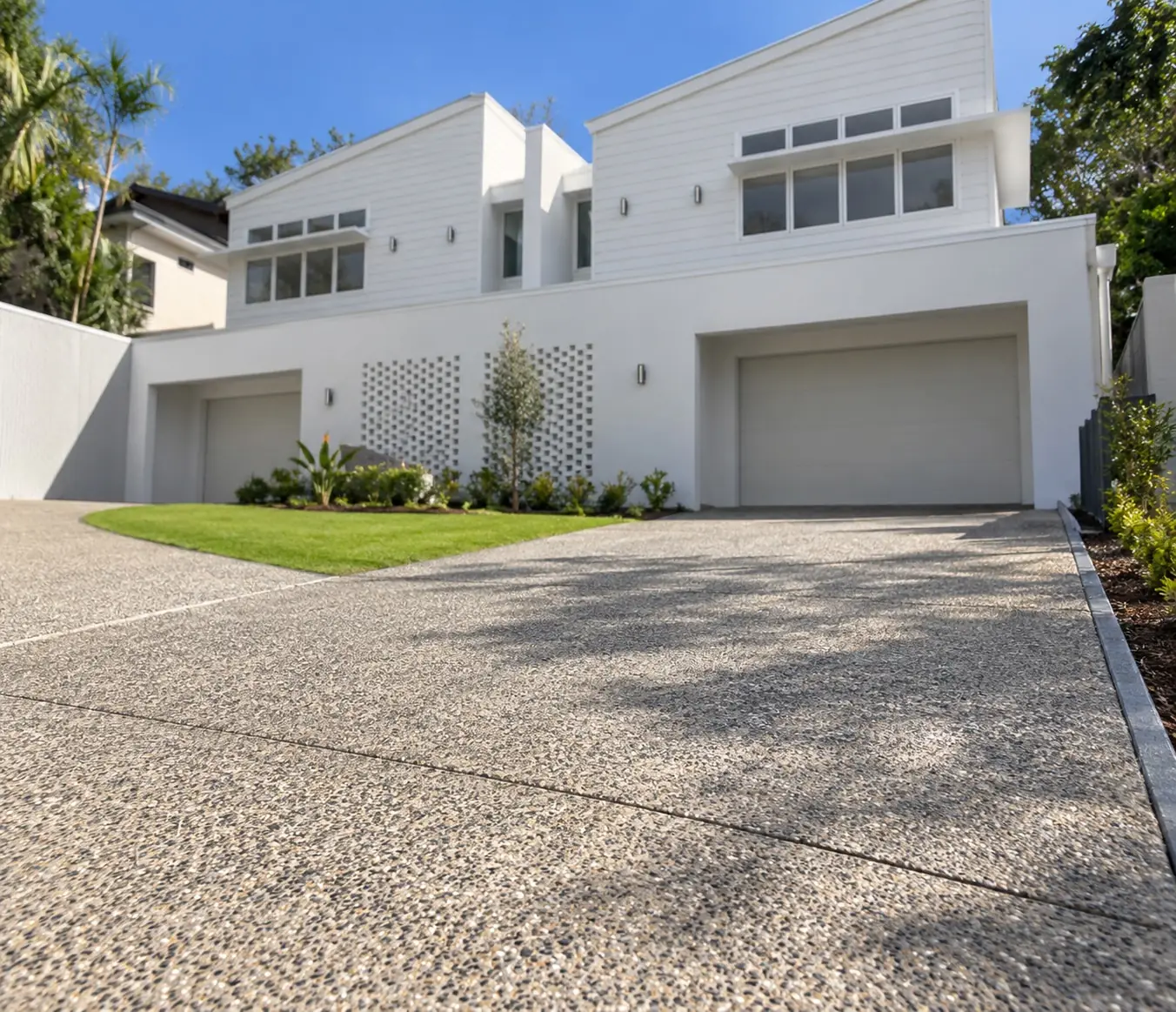 Exposed aggregate driveway in front of a two-storey Wollongong home