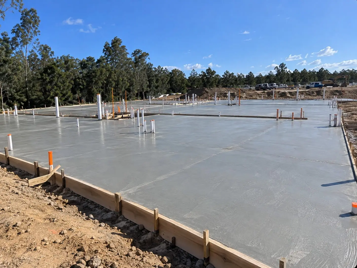 Freshly poured engineered house slab with plumbing set-outs in Wollongong